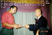 Guido Abdalla accepting 7th Dan diploma for his late instructor Francisco (Paco) Romero.