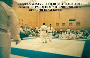 Canada'a Wesmore Smith prepares to shake hands with his opponent from Japan.