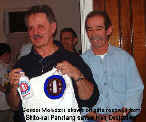 Sensei Moledzki shows off gifts received from Shito-Kai Penetang.