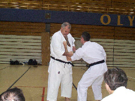 Defense against a lapel grab.