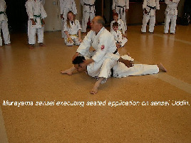 Murayama sensei executing seated application on sensei Uddin.