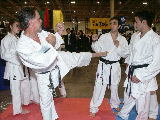 (L-R): Lisa Siroki (background) and Sensei Moledzki demonstrating side kick on Ehsan Dibaji, while Mohamed Fizali looks on.