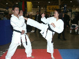 Dorothy Yu executes a roundhouse kick to Mohamed Fizali's head.