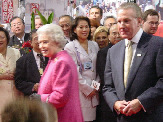 Her Majesty Queen Elizabeth II with Premier of Ontario, Ernie Eves, close behind.